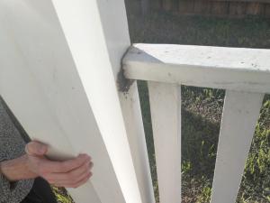 Railing and pillar disconnected from floor on front porch