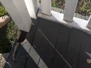 Railing and pillar disconnected from floor on front porch
