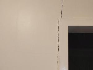 Cracks on ceiling and door frame in community housing property (SA)