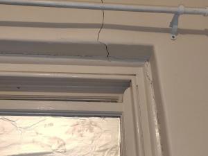 Cracks around window in community housing property (SA)