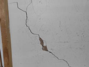 Cracks in wall in community housing property (SA)