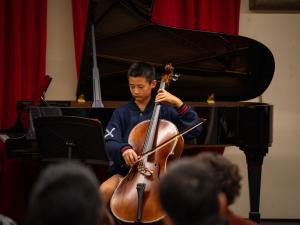 Nate Wang (cello) performing at our OMA Mid-Year Concerts 2025