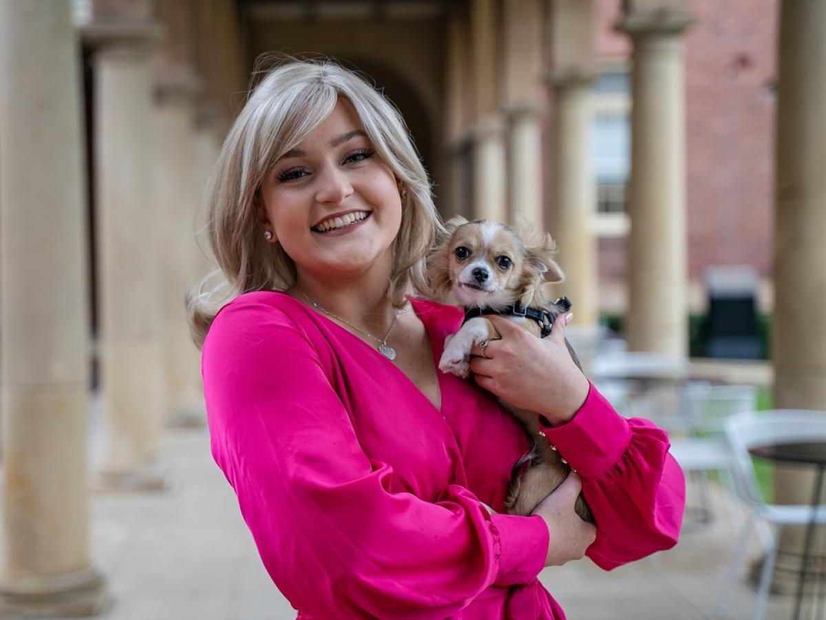 April Beak, dressed as Elle Woods, with Obie O'Brien the Chihuahua