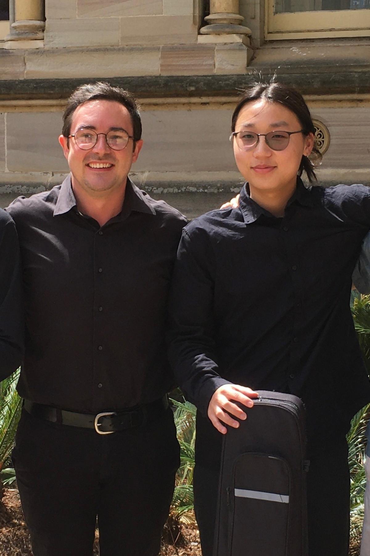 OMA Classical Guitar Teacher Caleb Lavery-Brook (left) with student Yuyao Wan (right)