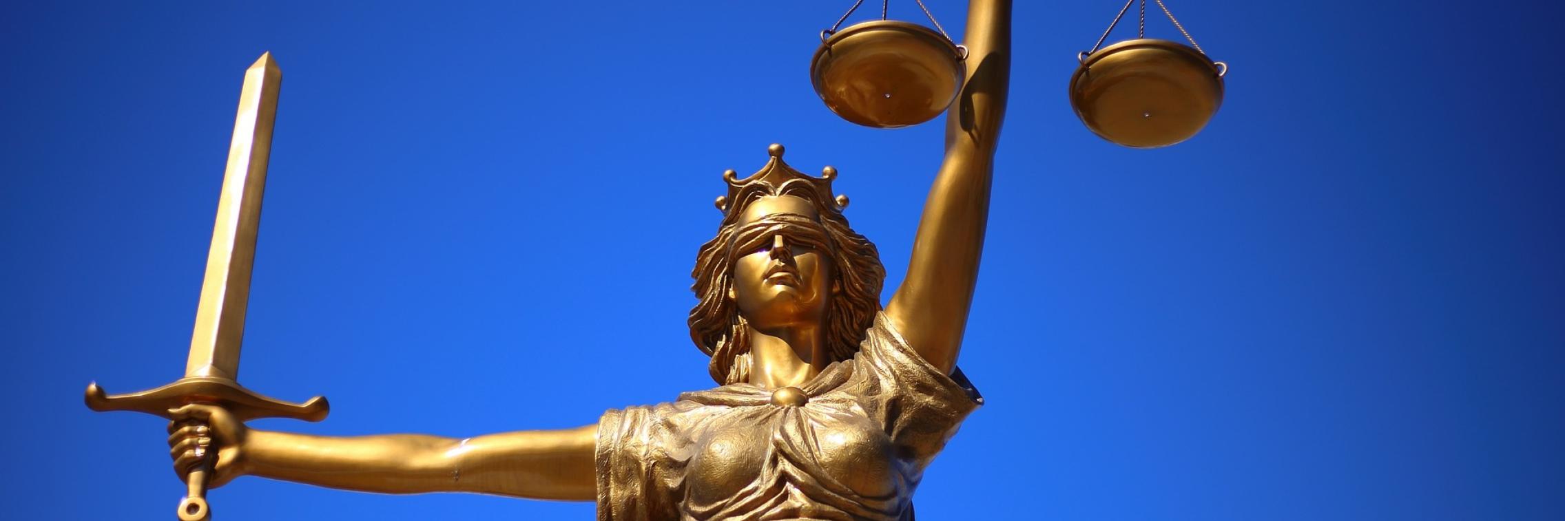 A gold statue represents justice