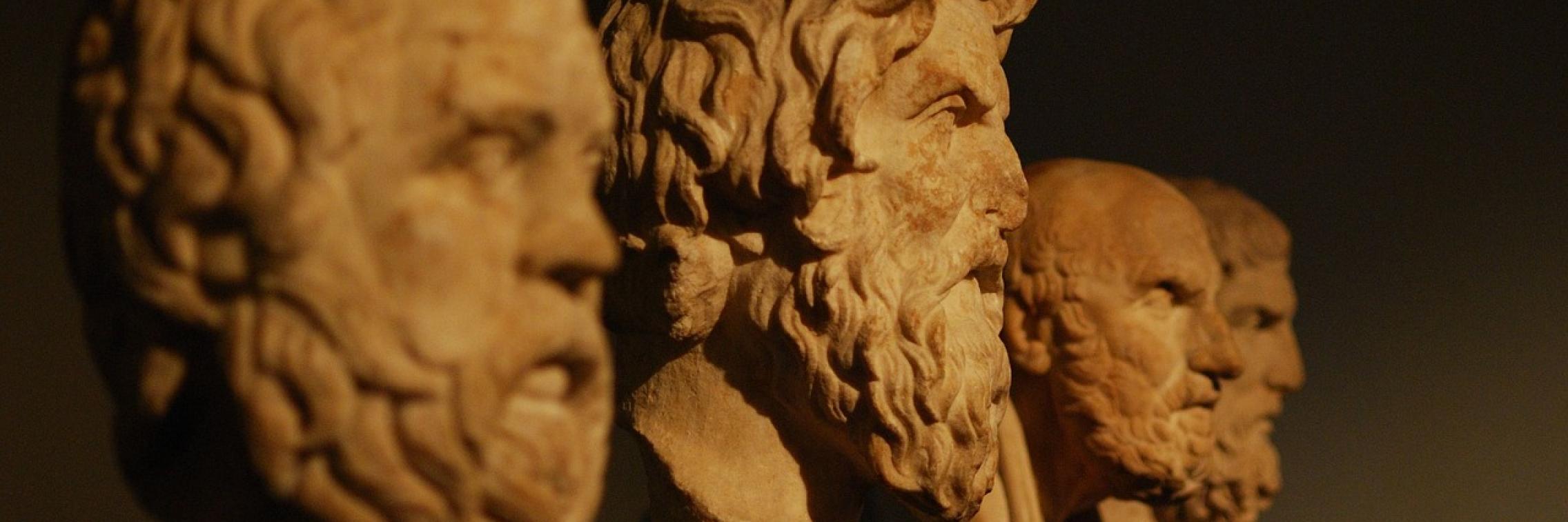 A row of philosophers' bust statues
