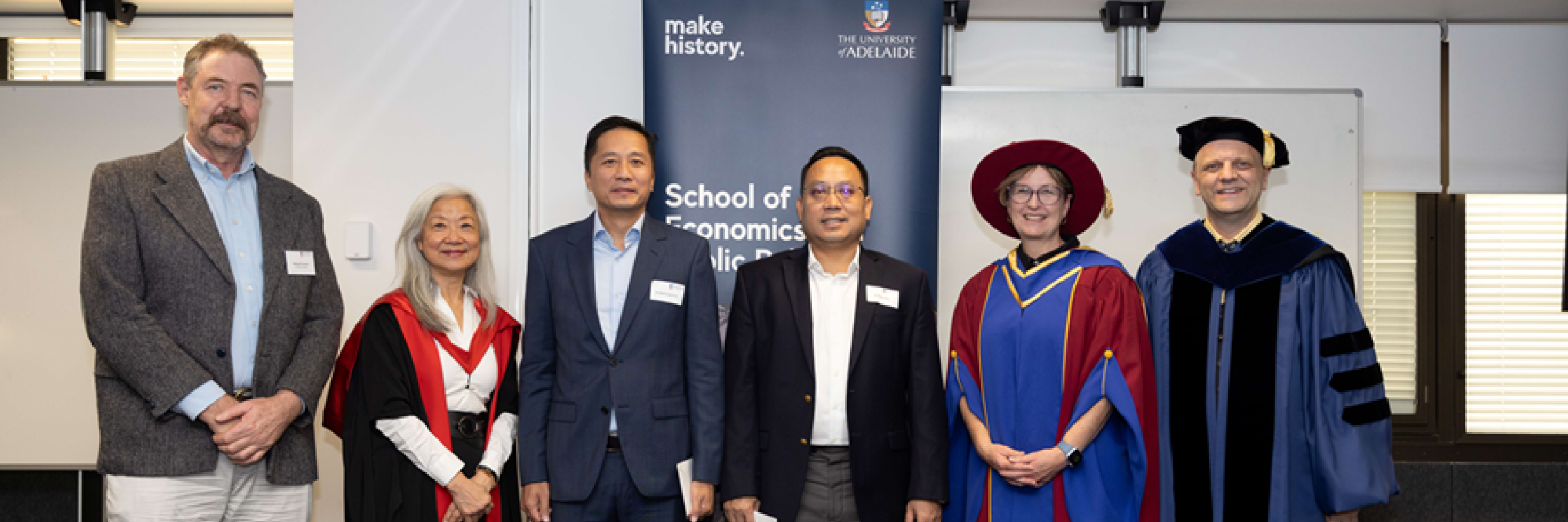 A group of SEPP academics pose and smile