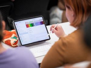 student using ipad in class