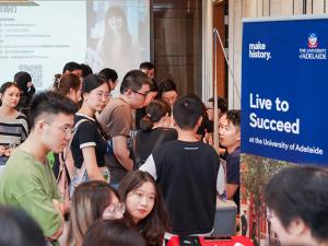 crowd of students speaking to advisors