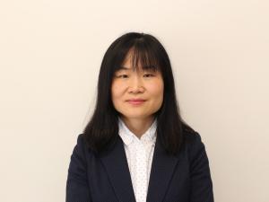Hong Cai smiles