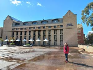 Paulina Fishman stands outside Adelaide Law School, Ligertwood building
