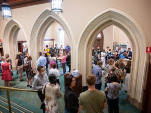 Faculty of ABLE staff mingling in Elder Hall after the awards