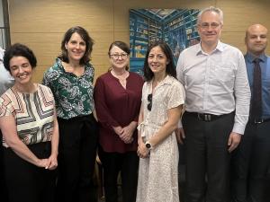 Staff from NC State University smile with staff of ABLE