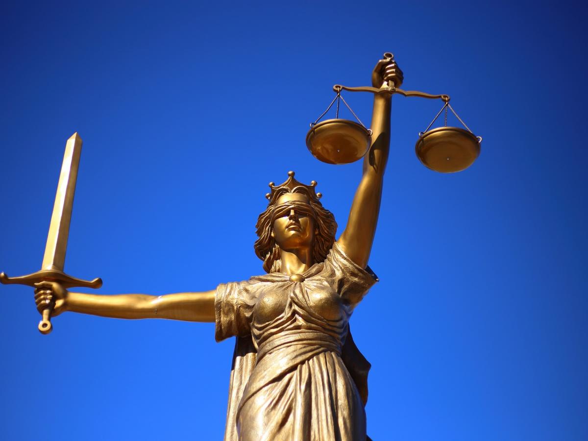 A gold statue represents justice