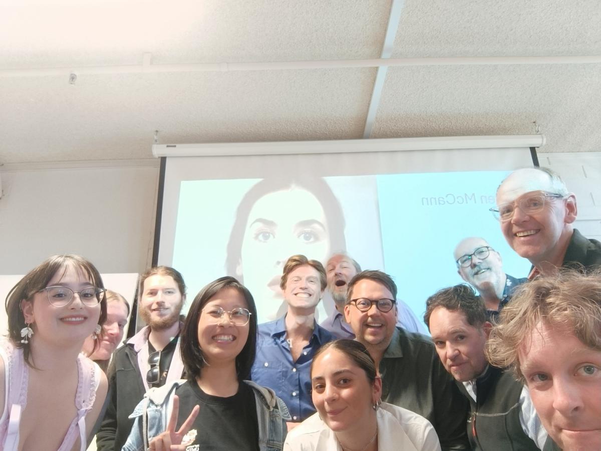 12 members of the Humanities Film Studies Group smile at the camera