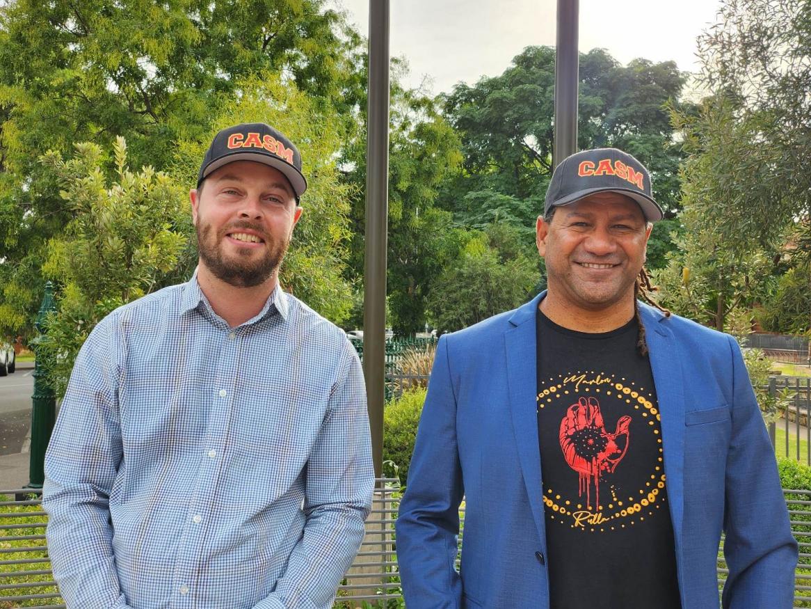 Grayson Rotumah and Dylan Crismani smile while standing in front of the Kaurna Learning Circle.