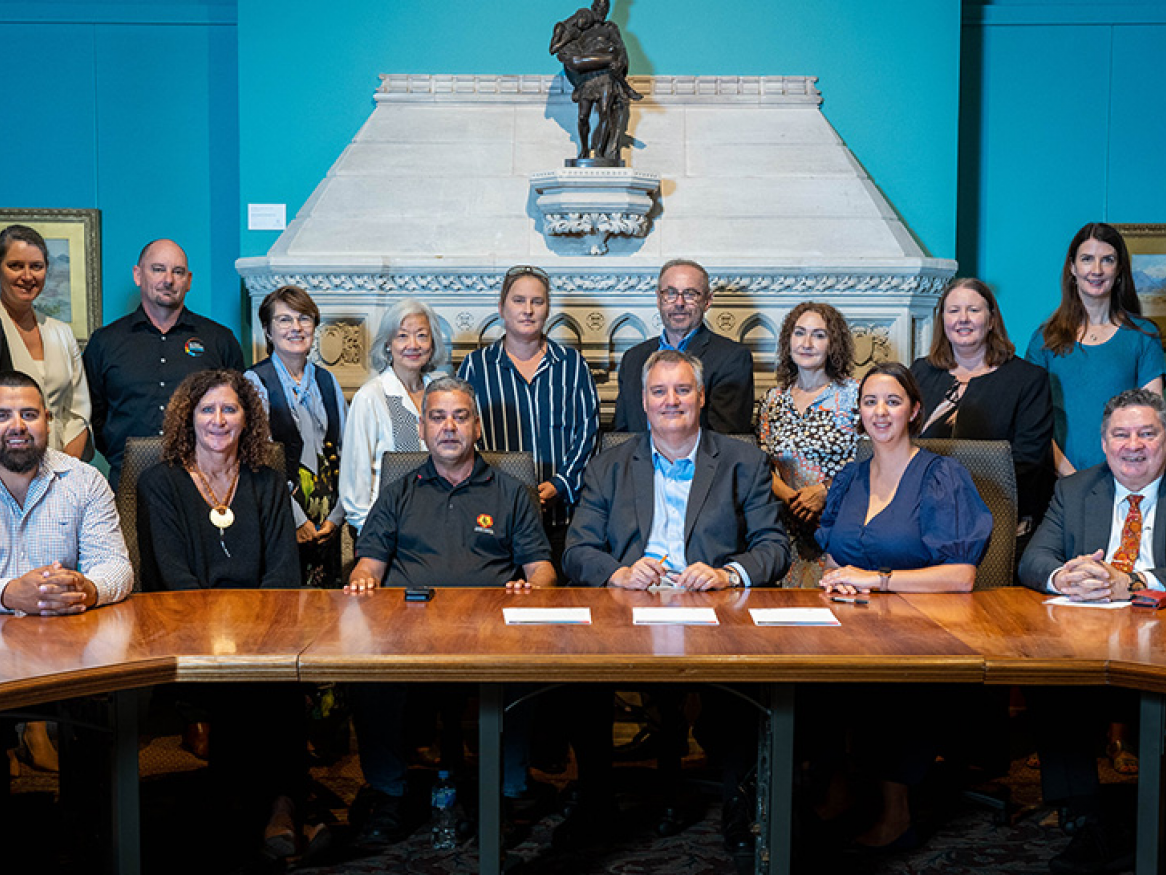 ABLE staff signing memorandum of understanding