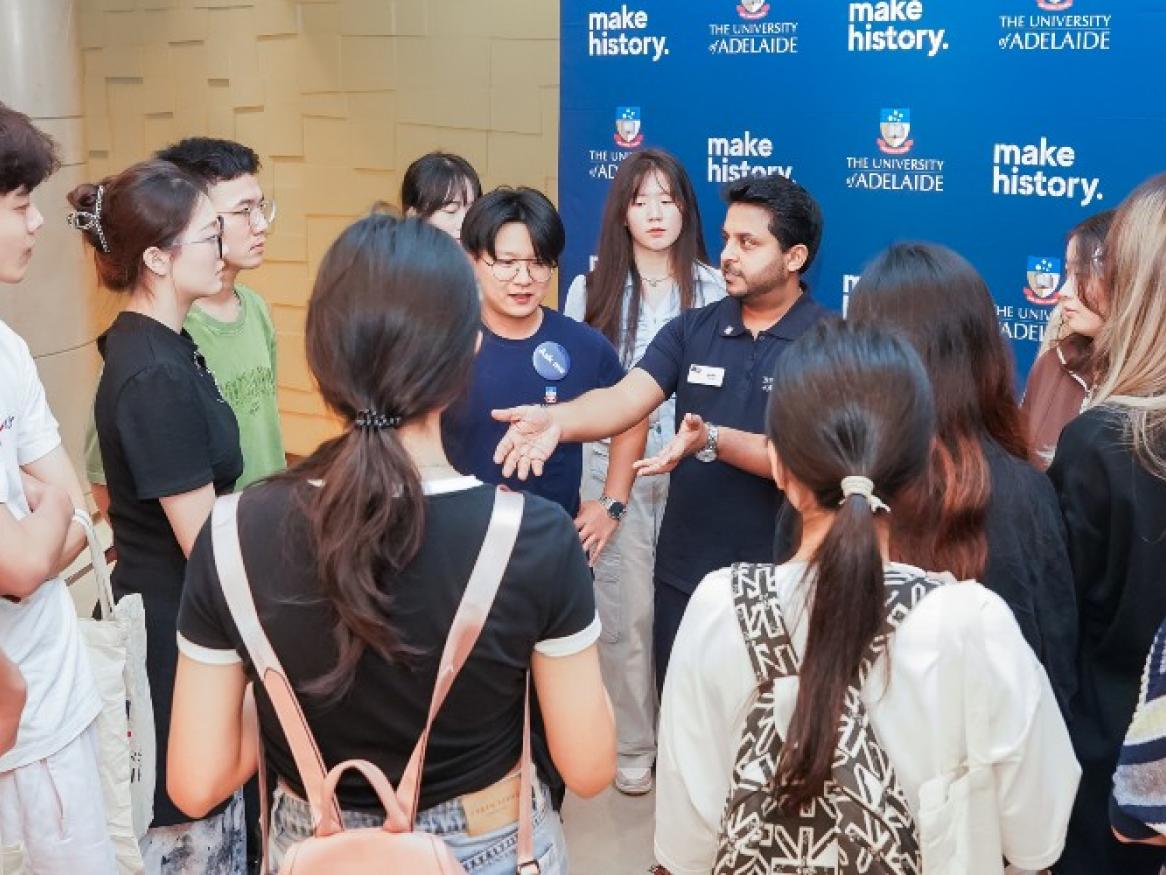 Ankit speaking with students