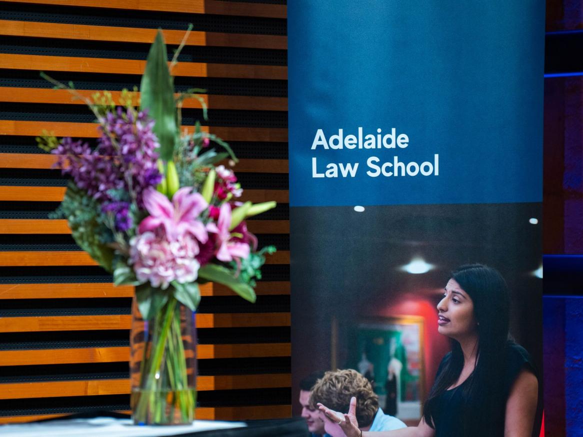 An Adelaide Law School pull-up-banner at a Law School event in 2023