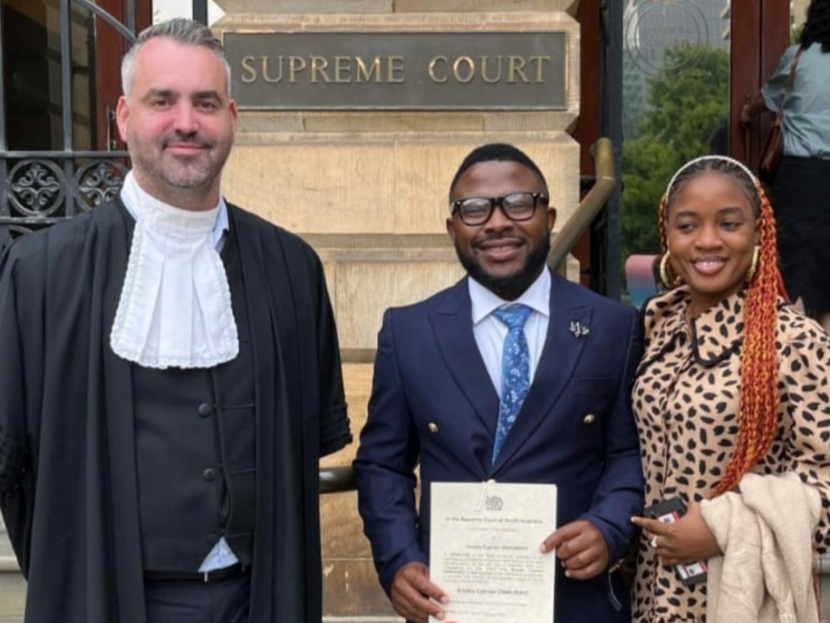 Emeka Onwubiko stands at the Supreme Court wearing a suit