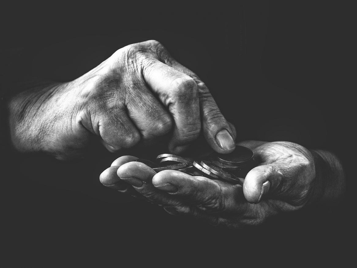 A close up image of someone handling money