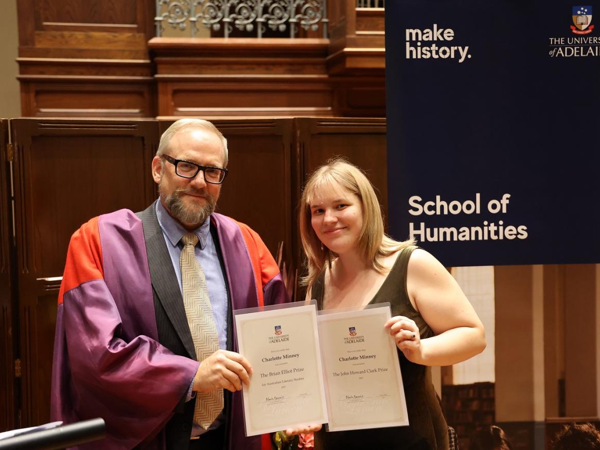 Professor Julian Murphet gives awards to Charlotte Minney