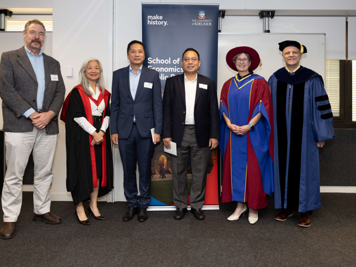 A group of SEPP academics pose and smile