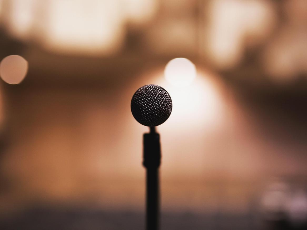 A microphone in front of a crowd