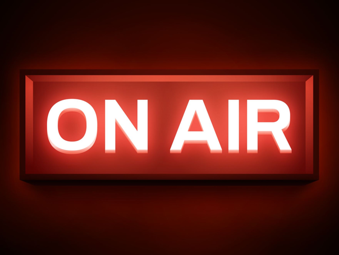 A red 'On Air' light glows